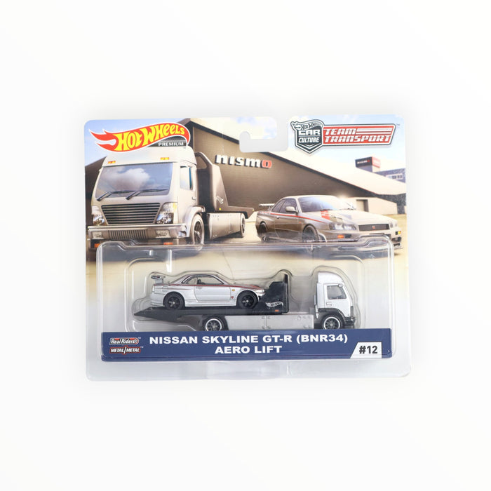 Hot Wheels Team Transport #12 Nissan Skyline GT-R R34 Con Aero Lift Transporter - Edizione Premium Sigillata - Foto 1
